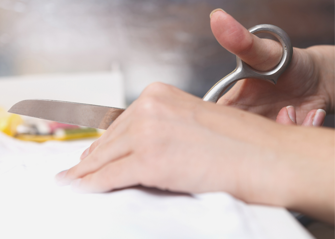 Sewist using a projector to display sewing patterns on fabric
