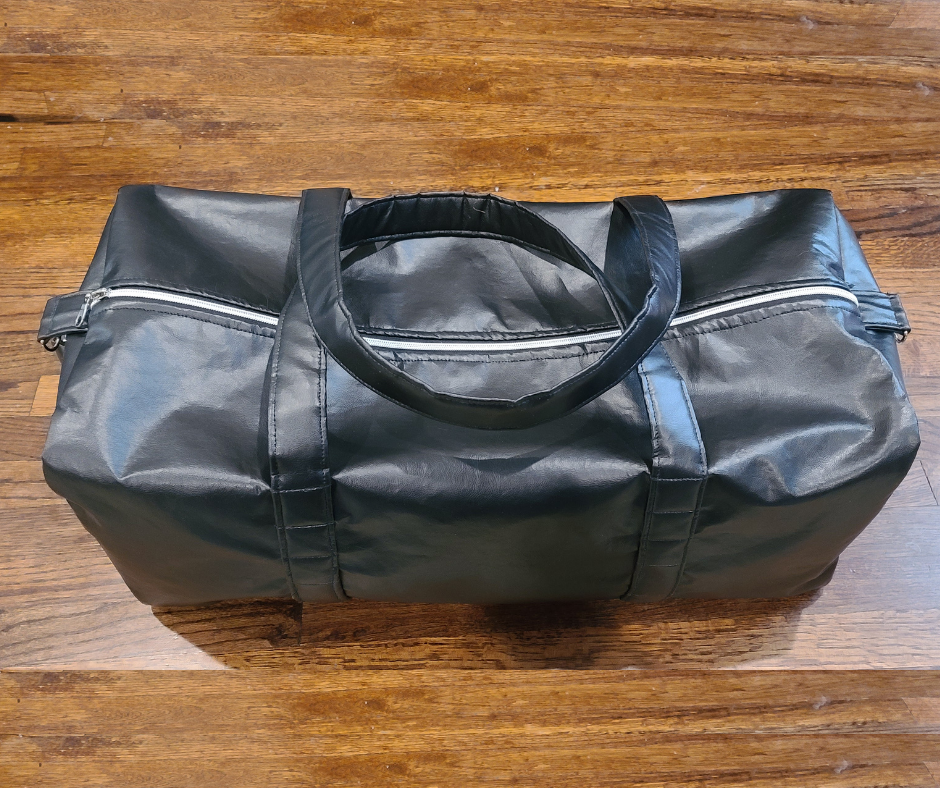 Finished 24-inch Wanderlust duffel bag with faux leather exterior and Hot Wheels fabric lining