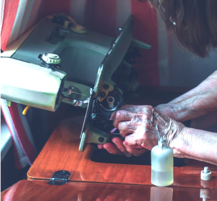 Applying oil to the moving parts of a sewing machine for maintenance