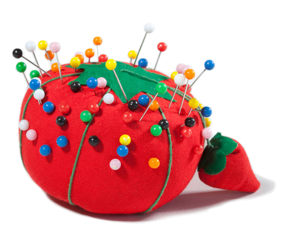 Magnetic wrist pin cushion with sewing pins