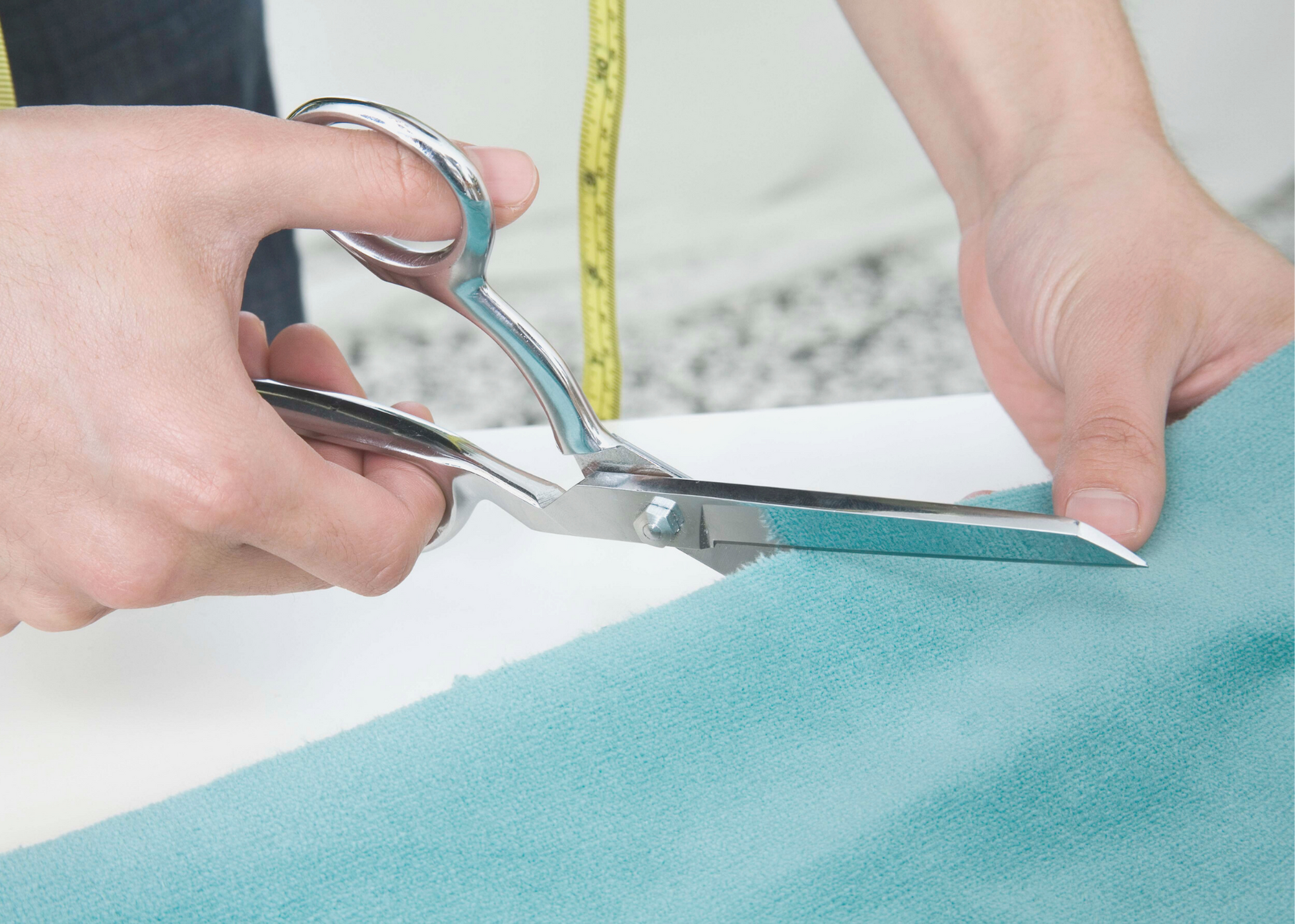 Sewist projecting a sewing pattern onto fabric using a projector