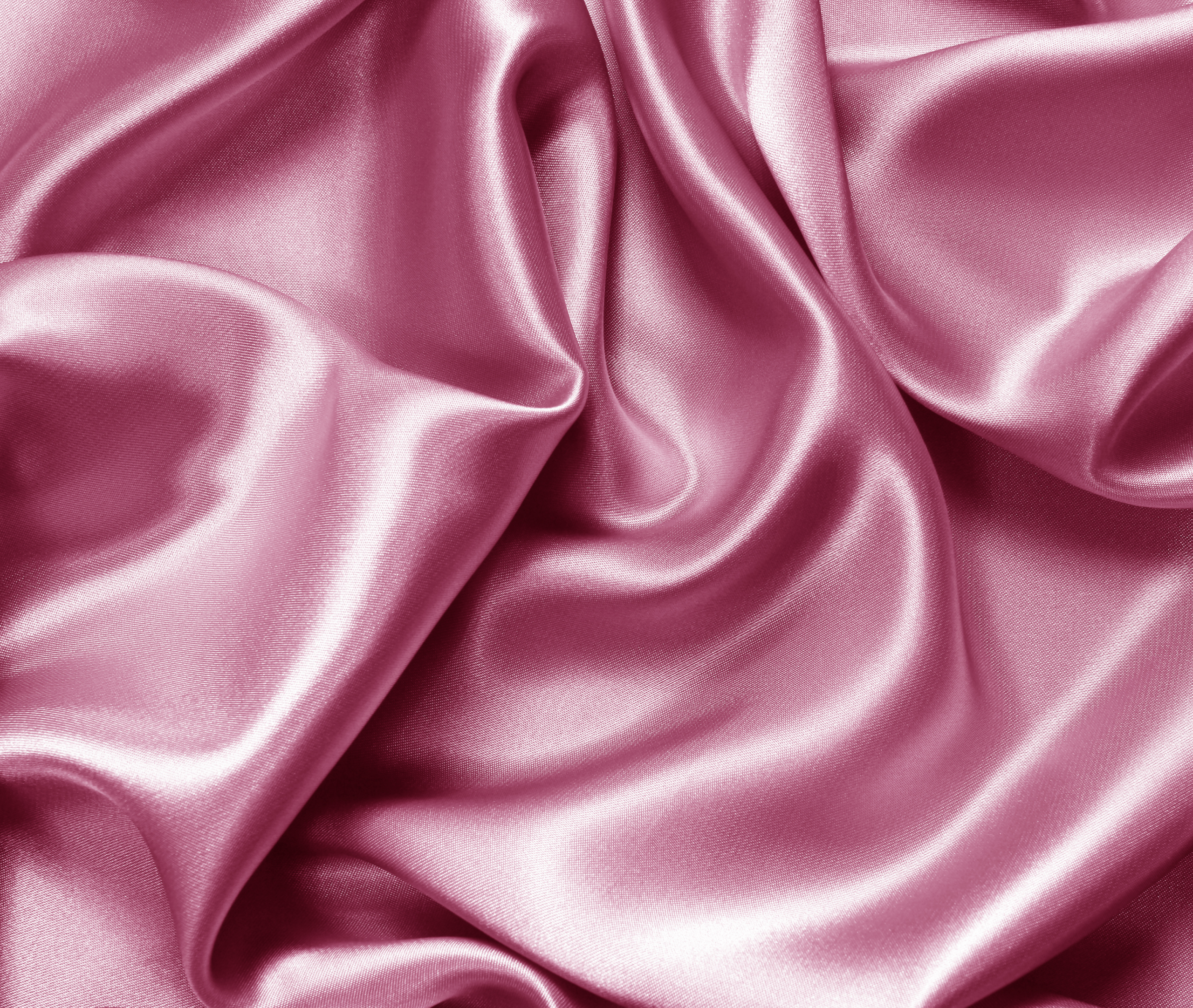 Close-up of smooth, shiny satin fabric ready for sewing